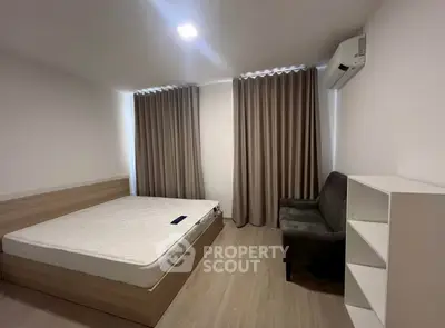 Modern minimalist bedroom with cozy bed, stylish curtains, and sleek air conditioning unit.