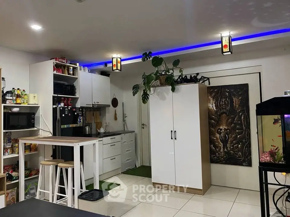 Modern kitchen with open shelving and breakfast bar in cozy apartment