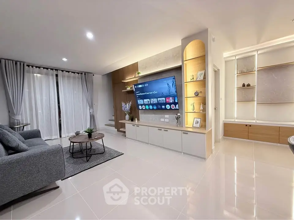 Modern living room with sleek TV setup and elegant decor