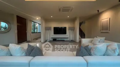 Luxurious modern living room with elegant decor and spacious layout, perfect for relaxation and entertainment.