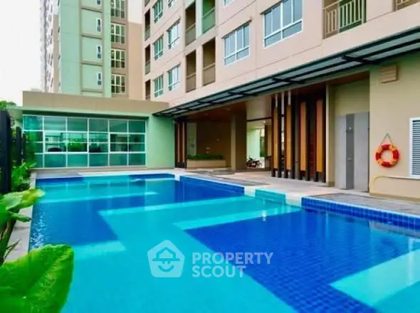 Luxurious condominium with stunning outdoor pool and modern architecture.