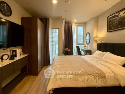 Modern bedroom with city view, stylish decor, and cozy ambiance in urban apartment.