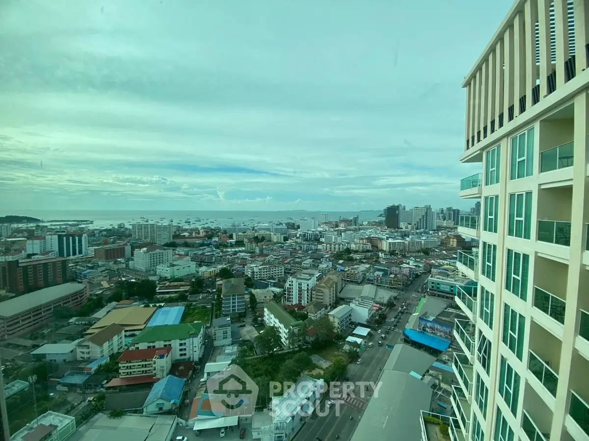 Stunning cityscape view from high-rise building with ocean in the background