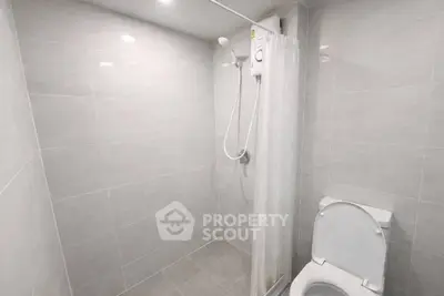 Modern bathroom with sleek tiles and shower area