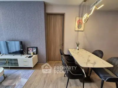 Modern living room with stylish dining area and sleek furniture