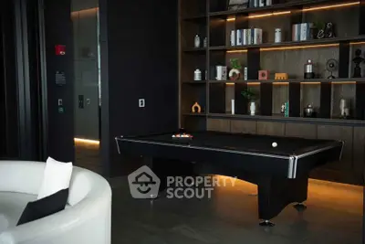 Luxurious modern living room with stylish pool table and elegant shelving.