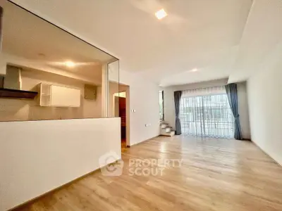 Spacious modern living room with open layout and large windows