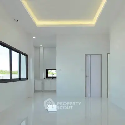 Spacious modern interior with large windows and sleek design