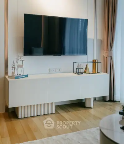 Modern living room with sleek TV setup and elegant decor