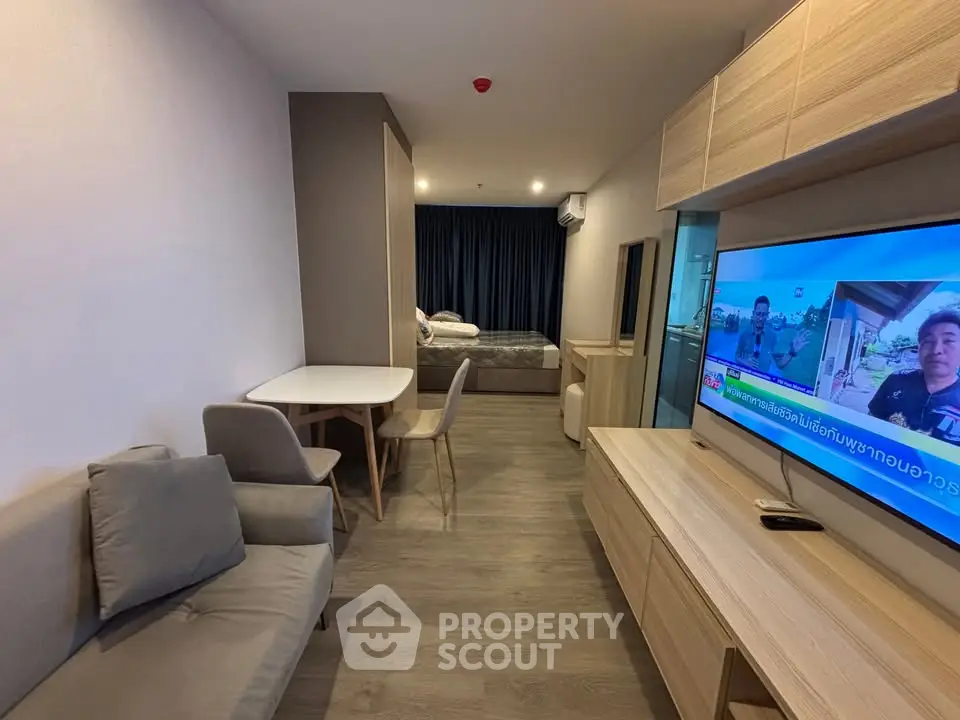 Modern studio apartment with cozy living area and stylish furniture