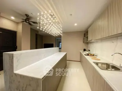 Luxurious modern kitchen with marble countertops and elegant lighting