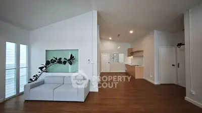 Spacious modern living room with open kitchen and stylish decor