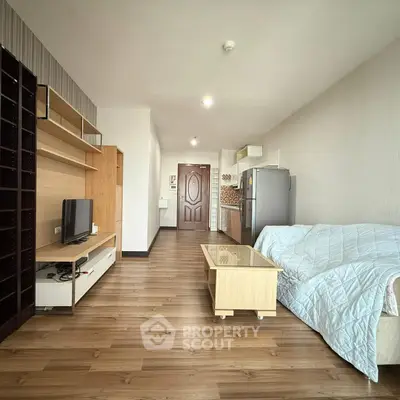 Spacious living room with modern furniture and open kitchen layout