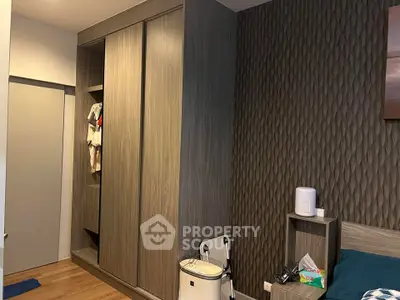 Modern bedroom with stylish wardrobe and textured wall design