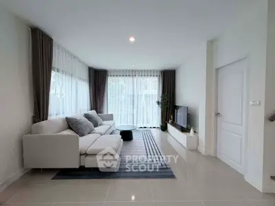 Spacious modern living room with elegant decor and natural light