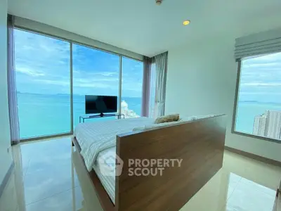 Luxurious bedroom with stunning ocean view and modern decor