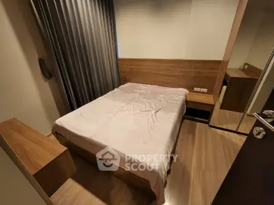 Cozy modern bedroom with wooden flooring and sleek furnishings