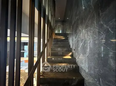 Luxurious marble staircase with modern design and ambient lighting