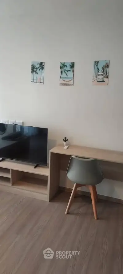 Modern living room with sleek TV stand and minimalist desk setup