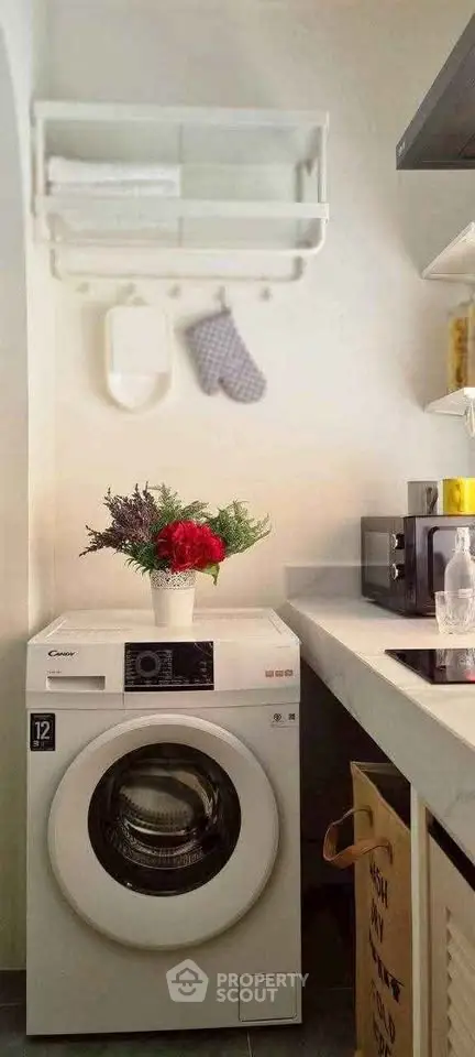 Charming kitchen corner with modern washing machine and stylish decor