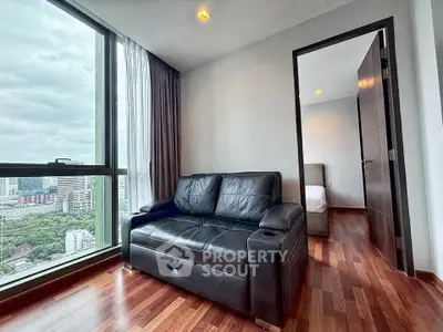 Modern apartment with city view and cozy leather sofa