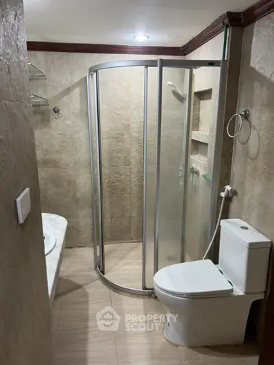 Modern bathroom with glass shower and sleek fixtures