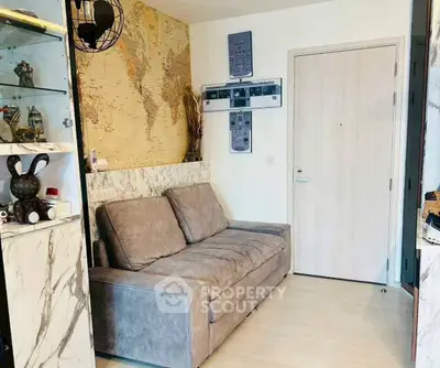 Cozy living room with modern decor and world map accent wall.