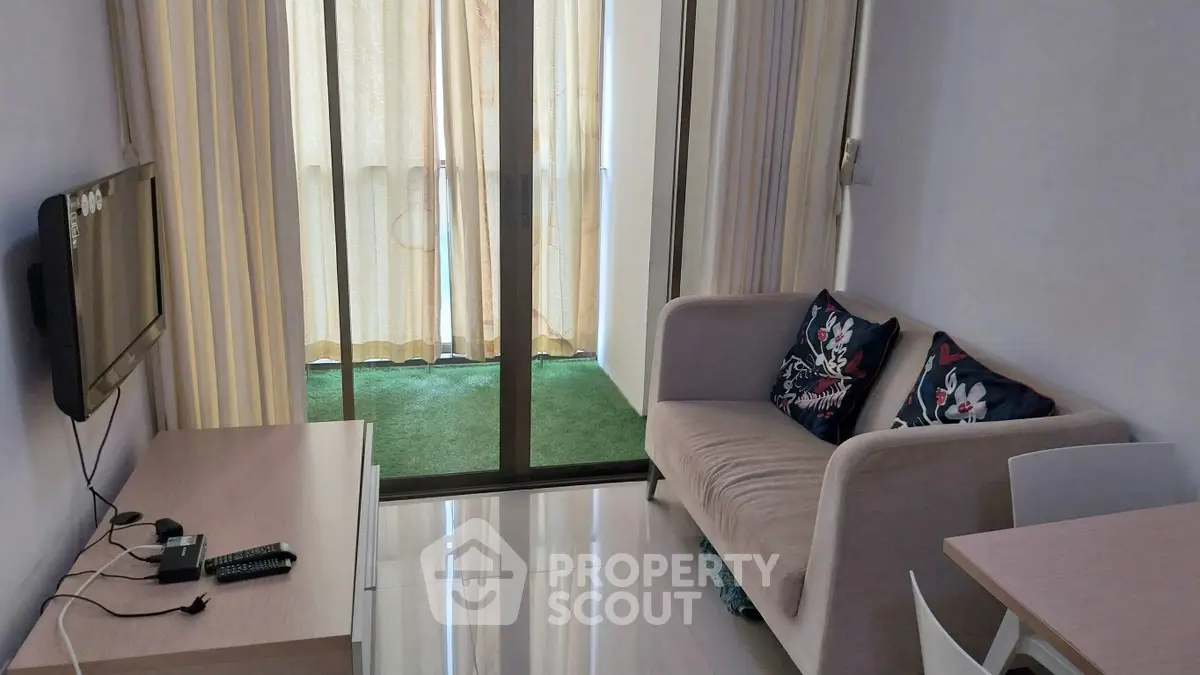 Cozy living room with balcony access and modern decor