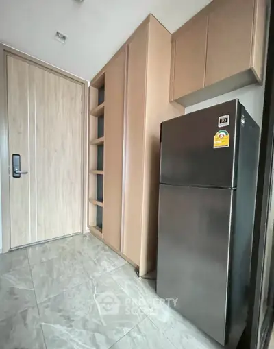 Modern kitchen with sleek refrigerator and ample storage space