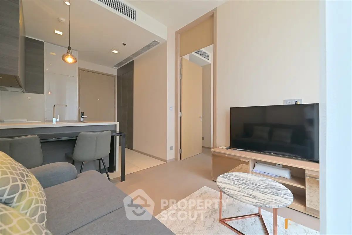 Modern living room with open kitchen and stylish decor