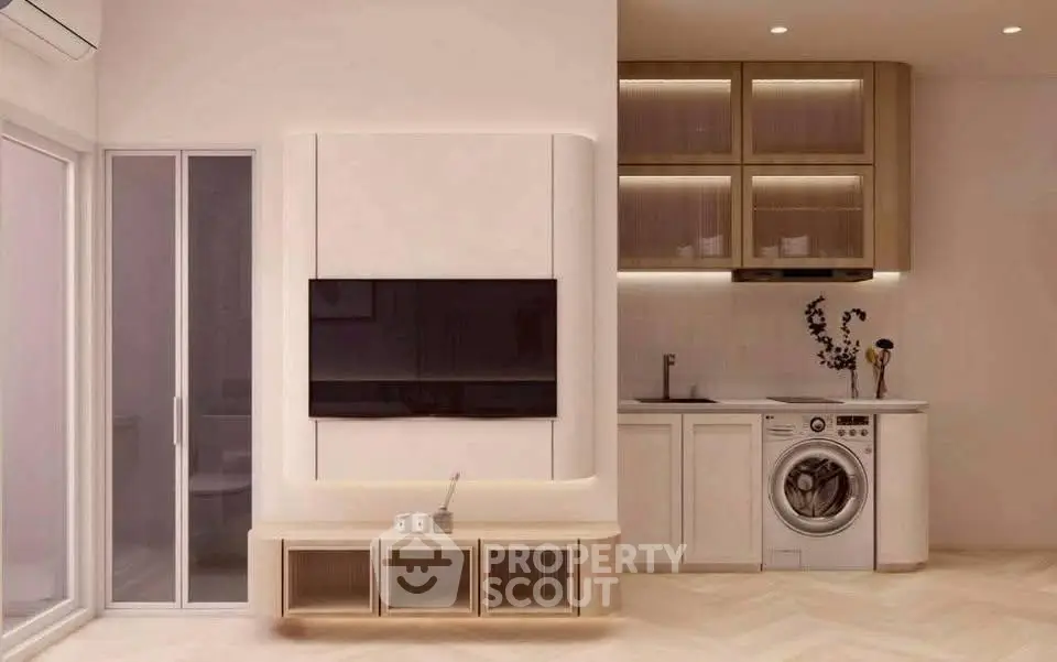 Modern living room with built-in TV, sleek cabinetry, and integrated washing machine.
