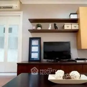 Modern living room with stylish shelves and entertainment setup