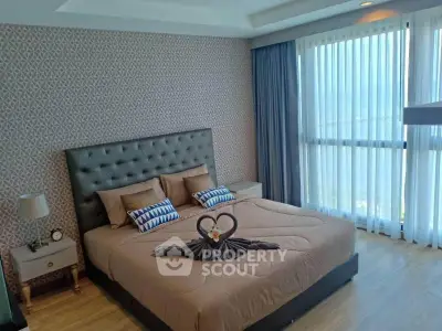 Luxurious bedroom with elegant decor and stunning city view