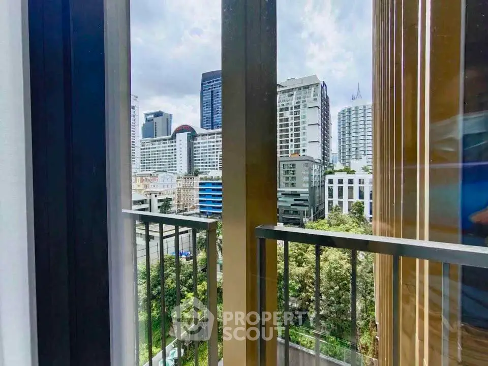Stunning city view from modern balcony with high-rise buildings