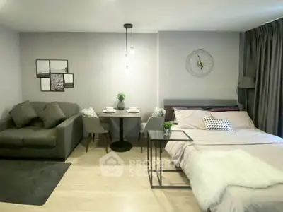 Cozy studio apartment with modern decor and comfortable furnishings