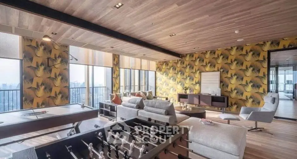 Luxurious living room with stunning city view, modern furniture, and entertainment area in high-rise apartment.