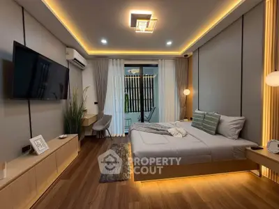 Luxurious modern bedroom with ambient lighting and stylish decor