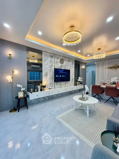 Luxurious modern living room with elegant lighting and stylish decor, perfect for entertaining guests.