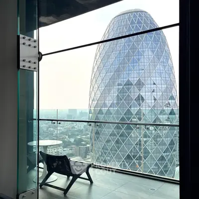 Stunning balcony view with iconic city skyline and modern architecture.