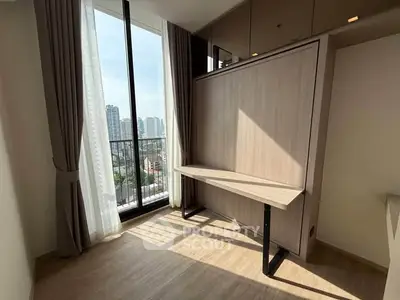 Bright study room with large window and city view in modern apartment