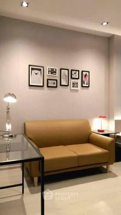 Modern living room with stylish sofa and wall art, perfect for cozy relaxation.