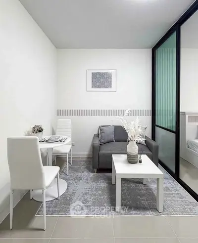 Modern living room with sleek furniture and glass partition, perfect for urban living.