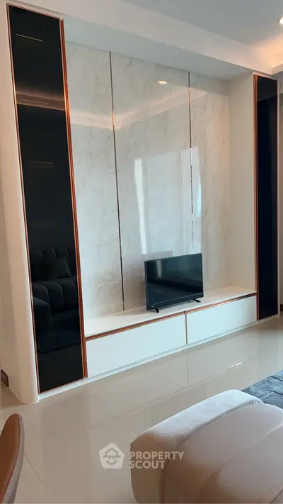 Modern living room with sleek TV unit and marble accent wall