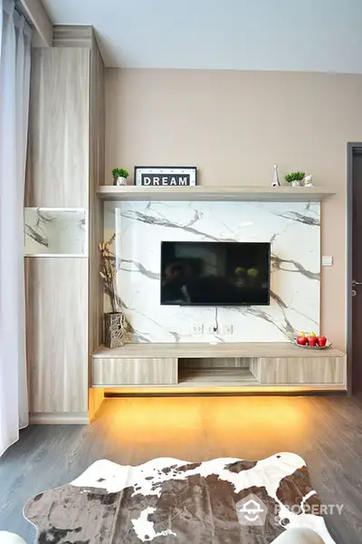 Modern living room with stylish TV unit and marble accents