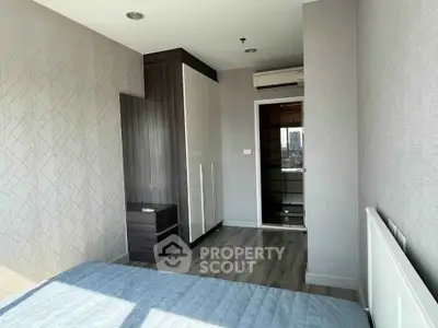 Modern bedroom with sleek design and ample natural light