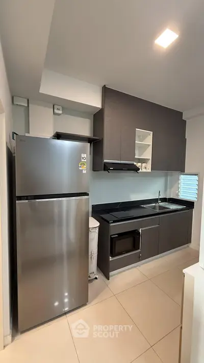 Modern kitchen with sleek cabinetry and stainless steel appliances