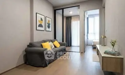 Modern living room with cozy sofa and stylish decor in a bright apartment.