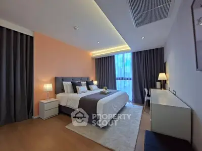 Luxurious bedroom with elegant decor and ambient lighting in modern apartment.