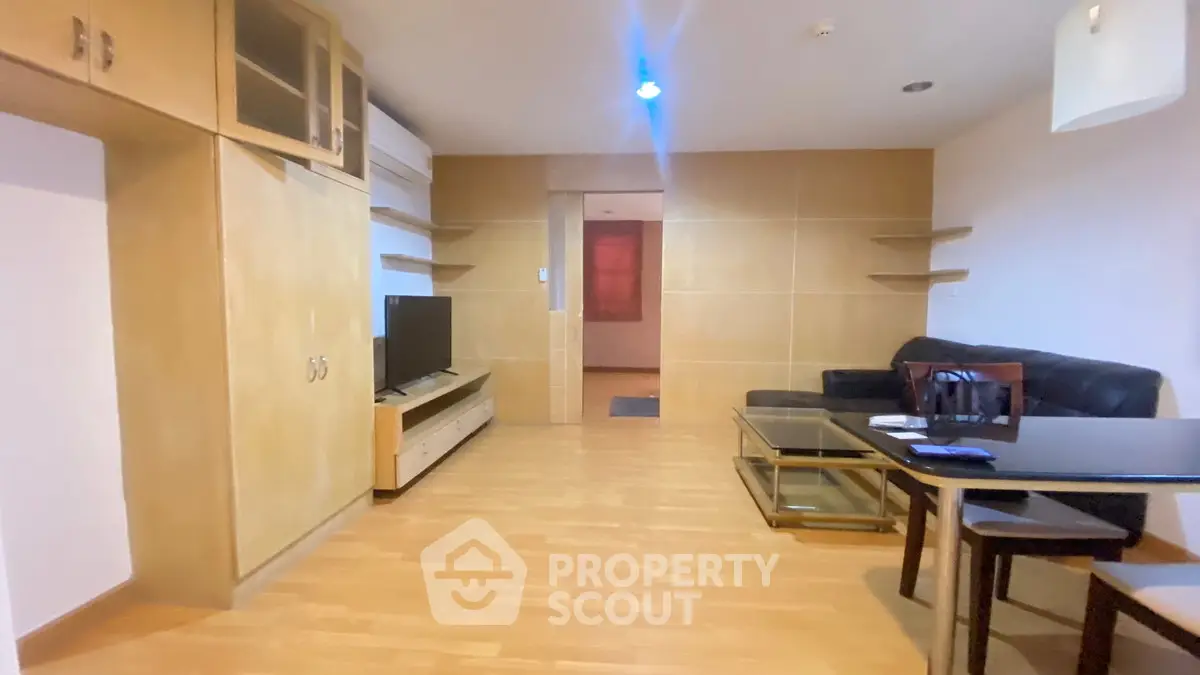 Spacious living room with modern furniture and wooden flooring