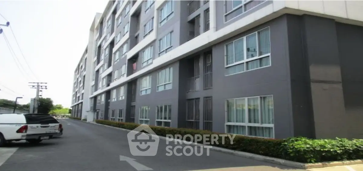 Modern apartment building exterior with clean lines and large windows